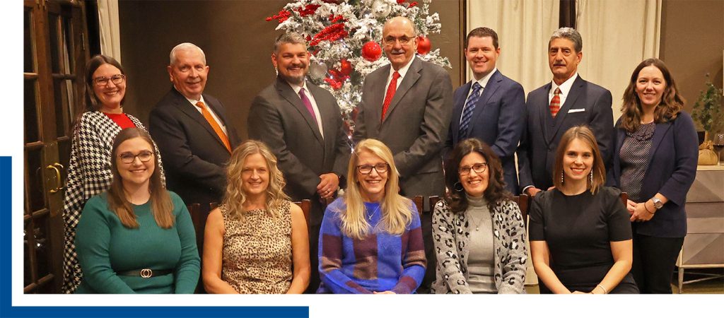 H&M Staff sitting together for a group photo